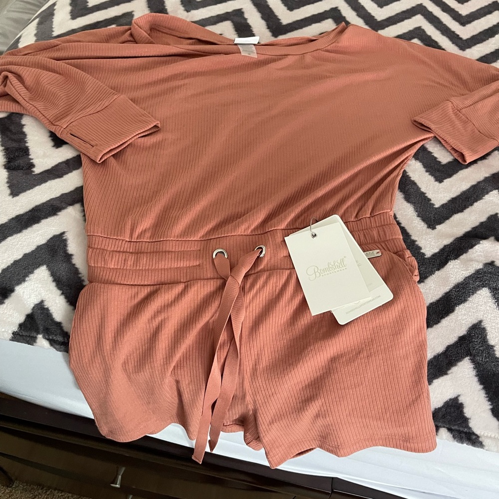 New with tags cute lil romper very comfortable size M